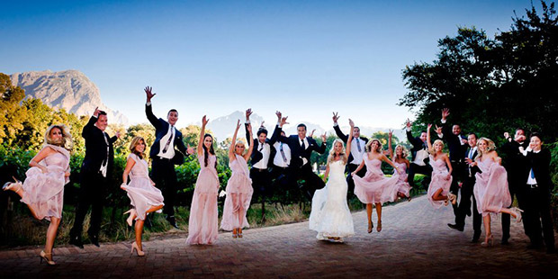 Wedding Party leaping into the air