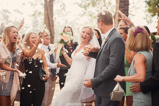 Bride and Groom are showered with Confetti